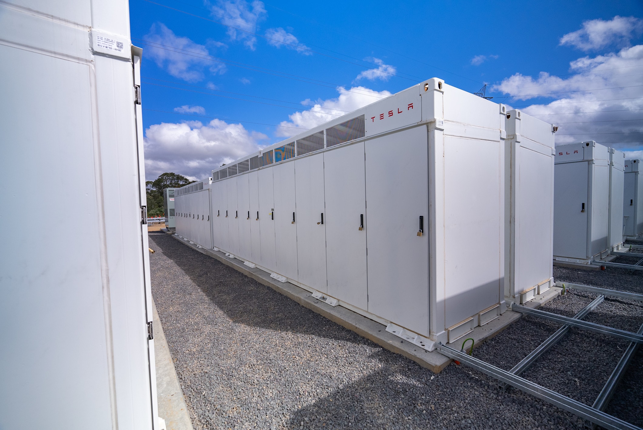 Tesla battery packs in containers
